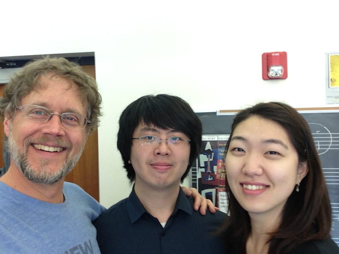 Photo of Xak Bjerken with former students Fred Dong and Kyuree Kang